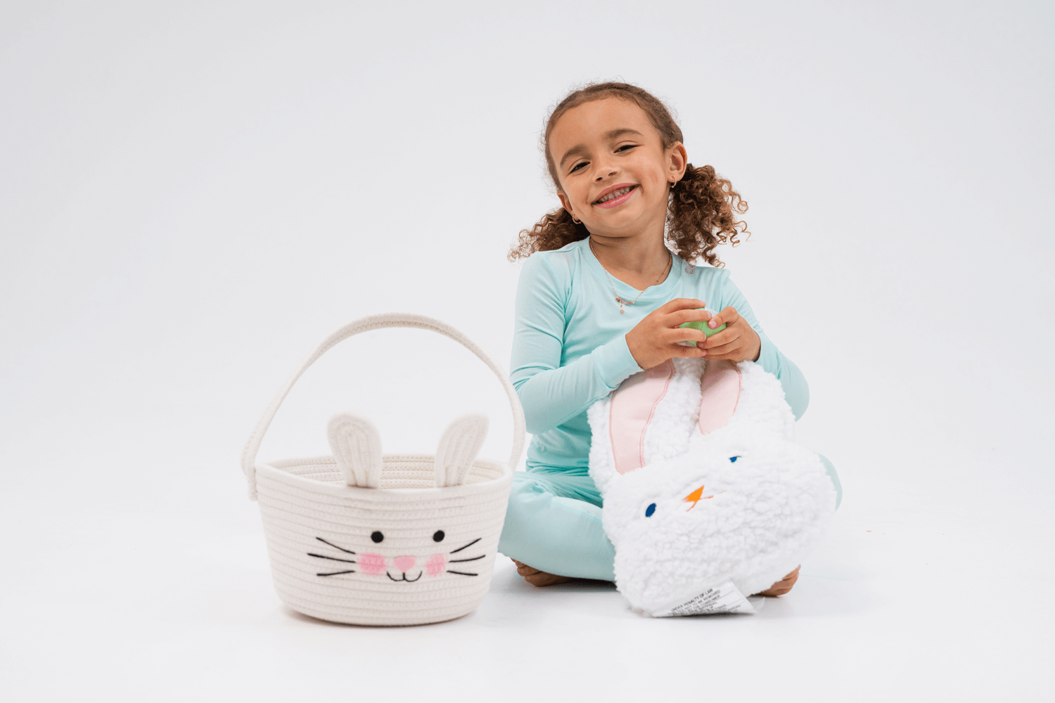 child wearing bamboo pajamas with easter baskets