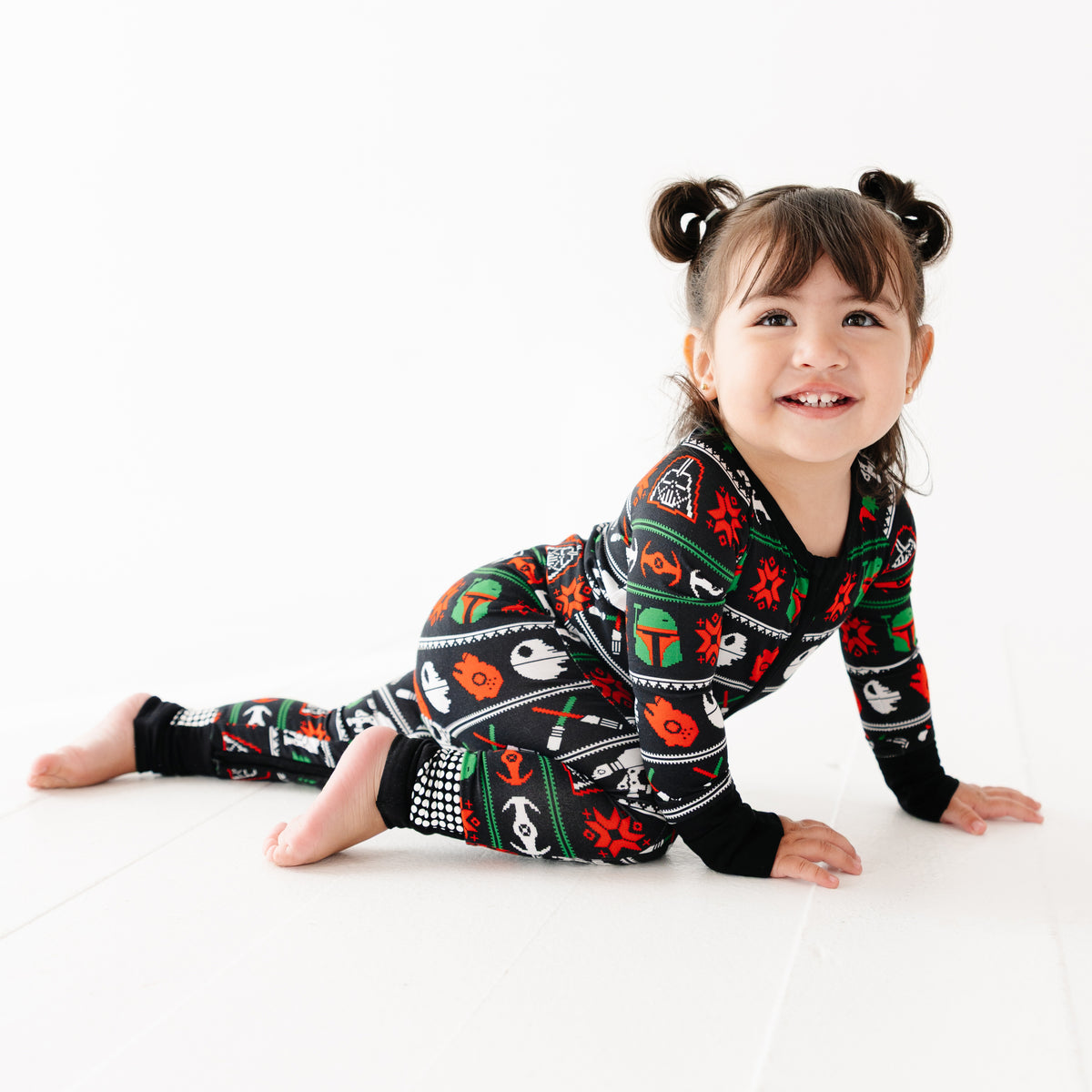 Smiling toddler crawling in the Merry Galaxy convertible romper