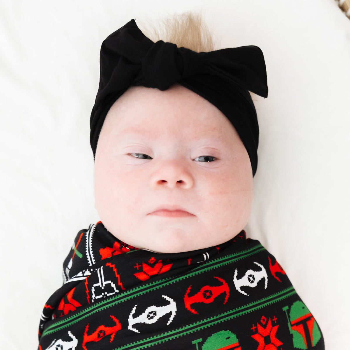 Baby wearing the Black Bow Headband in soft bamboo
