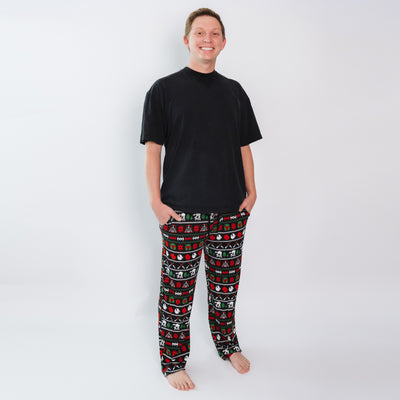Man wearing Merry Galaxy men's bamboo pajama pants with a black tee