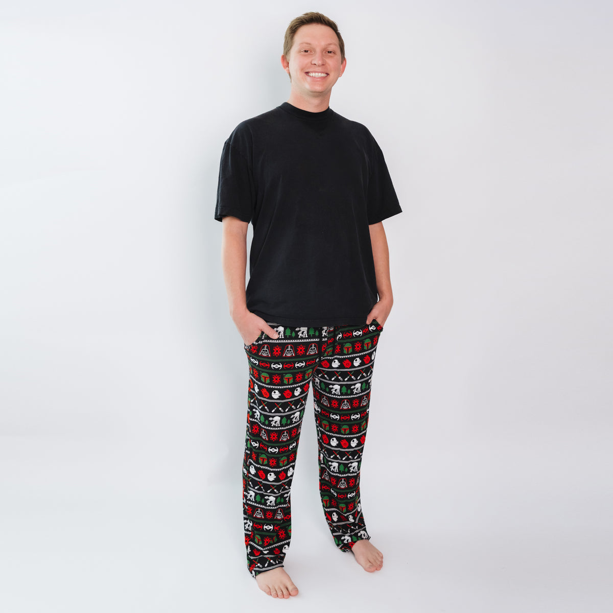 Man wearing Merry Galaxy men's bamboo pajama pants with a black tee