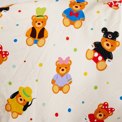 Close-up of the Main Street Bears swaddle print with teddy bears and confetti dots