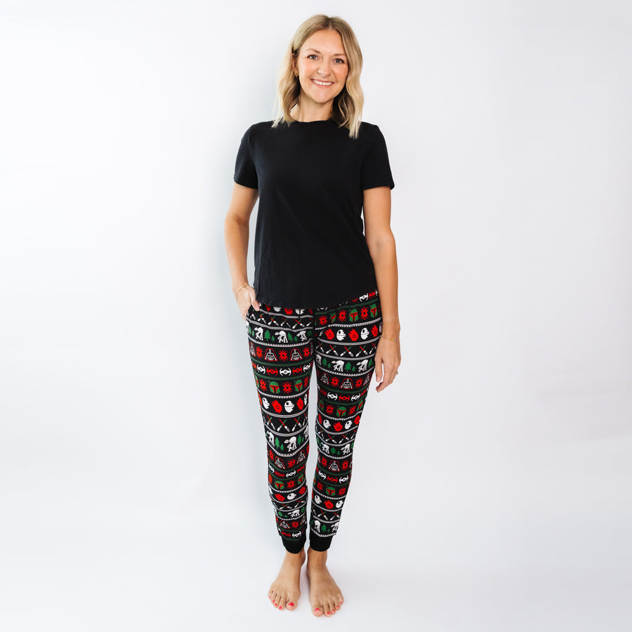 Woman wearing Merry Galaxy bamboo pajama pants with a black tee